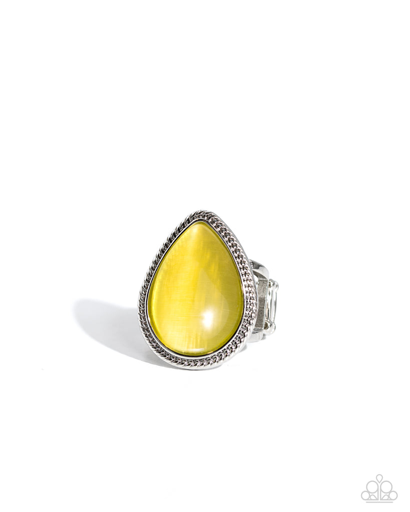 Encased in a layered silver frame of smooth rope-like texture, an oversized yellow cat's eye teardrop shines amongst airy bands of silver, creating a dramatic display of color atop the finger. Features a stretchy band for a flexible fit.  Sold as one individual ring.