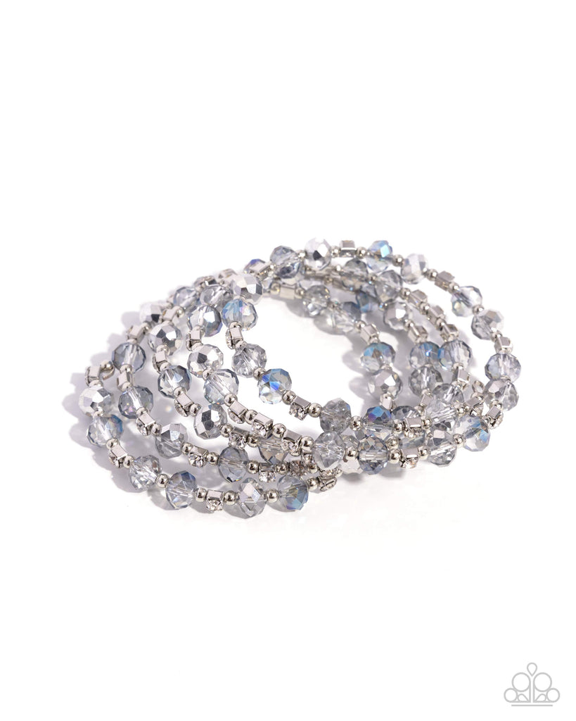 Brushed in a UV coating, reflective faceted clear beads, clear beads, silver beads, and white rhinestones in square fittings are threaded along a coiled wire, creating a refined infinity wrap-style bracelet around the wrist.  Sold as one individual bracelet.